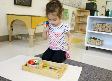 A toddler learning her colors in our Montessori toddler classroom.